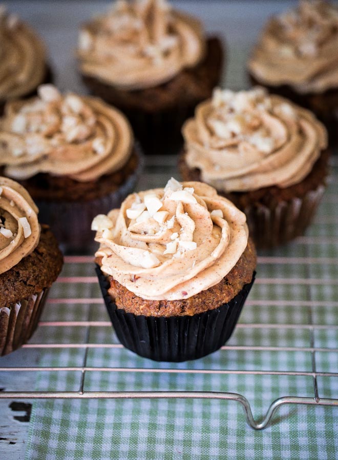 Light, fluffy muffins that taste like apple pie! Topped with whipped peanut butter frosting for a divine little treat! #muffins #peanutbutter #muffinrecipe #breakfastmuffins | Recipe on thecookandhim.com