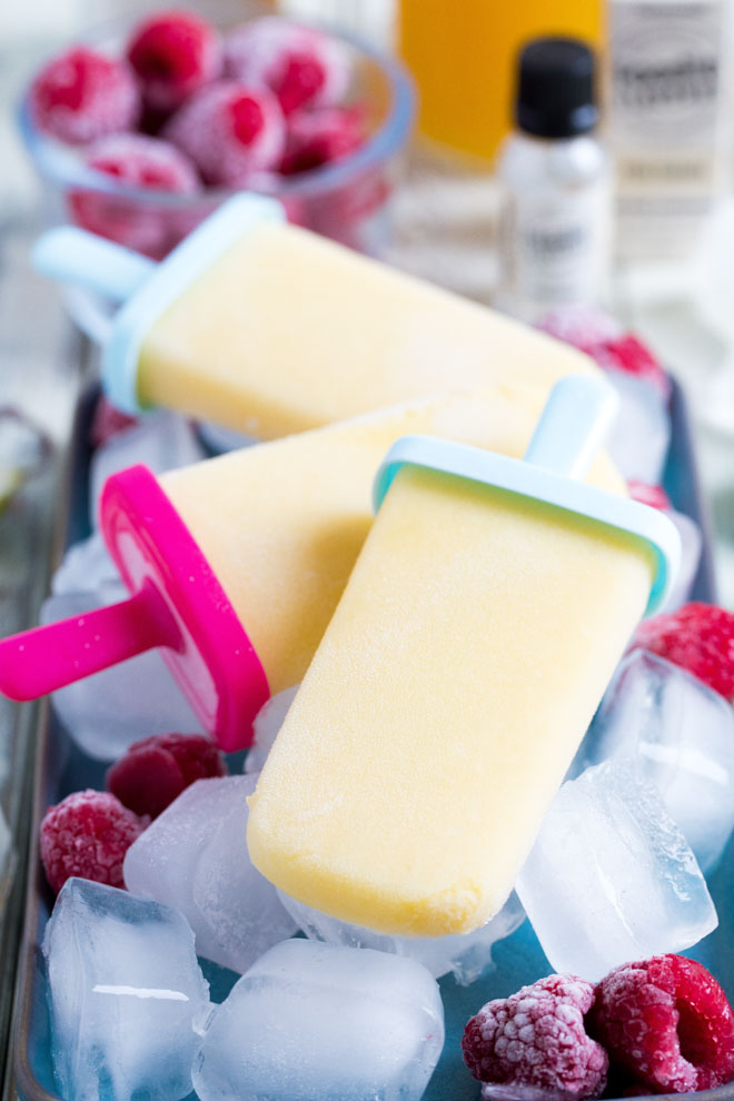 Refreshing non-alcoholic pina colada ice lollies, so easy to make but guaranteed to get you in the mood for summer! #veganrecipes #icelollies #summerrecipes #pinacolada | Recipe on thecookandhim.com