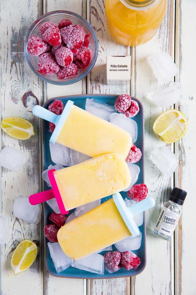 Refreshing non-alcoholic pina colada ice lollies, so easy to make but guaranteed to get you in the mood for summer! #veganrecipes #icelollies #summerrecipes #pinacolada | Recipe on thecookandhim.com