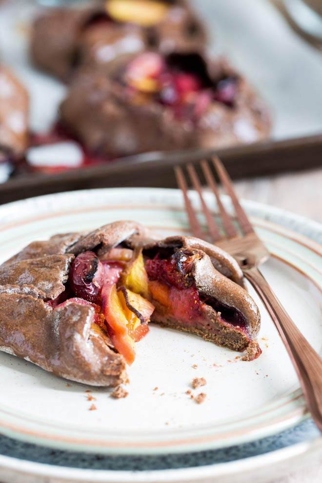 A burst of bright fruity flavour in every bite of these vegan and gluten free summer fruit galettes! #vegandessert #veganbaking #summerfruits #galette | Recipe on thecookandhim.com