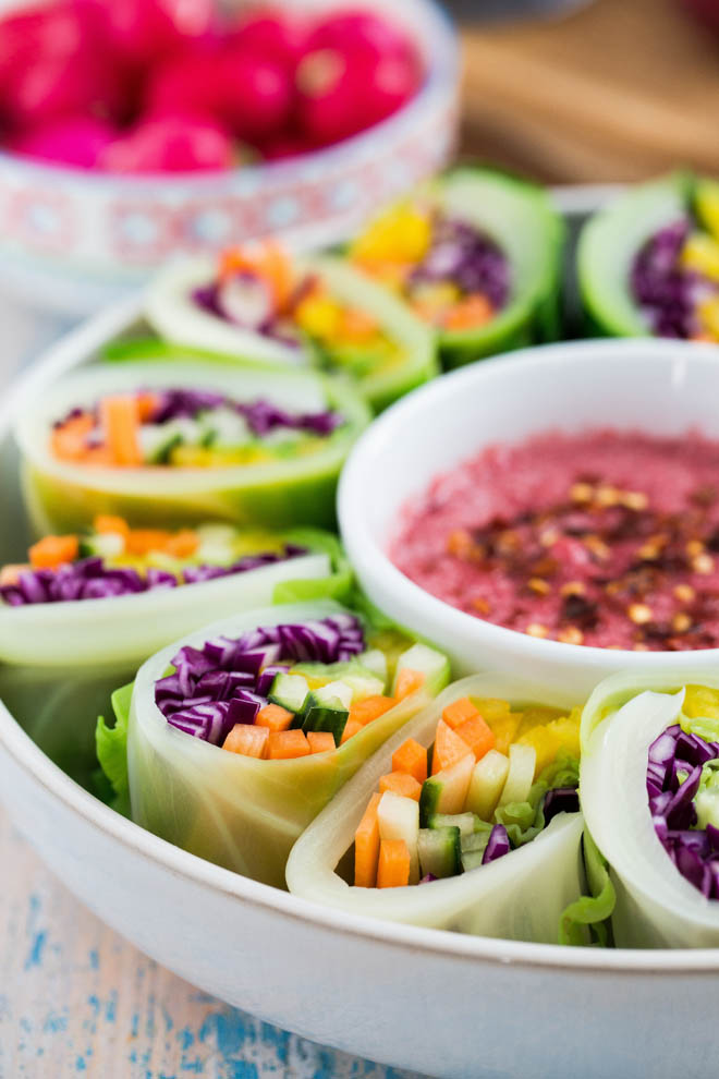 Brighten the darkest day with these rainbow vegetable spring rolls! Colourful veggies wrapped in sweetheart cabbage served with a spiced plum sauce #veganrecipes #rainbowveggies #plumsauce #chinesefood #springrolls #cabbage | Recipe on thecookandhim.com
