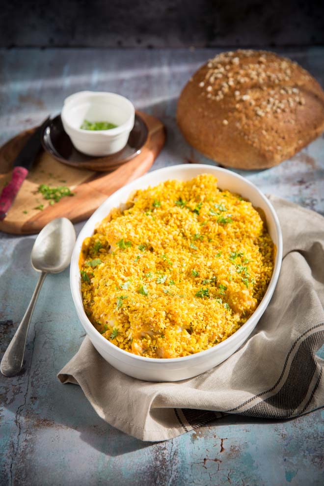 Creamy and delicious this lightly spiced vegan cauliflower cheese is topped with golden panko breadcrumbs and baked to bubbling, crispy perfection! #veganrecipes #vegansides #cauliflower #vegancheese #vegancauliflowercheese | Recipe on thecookandhim.com