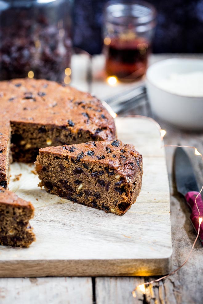 A wonderfully indulgent vegan Christmas cake absolutely packed with fruit and spice. It's rich, moist, delicious and deceptively easy to make! #christmascake #veganchristmascake #fruitcake #veganchristmasrecipes #veganchristmas | Recipe on thecookandhim.com