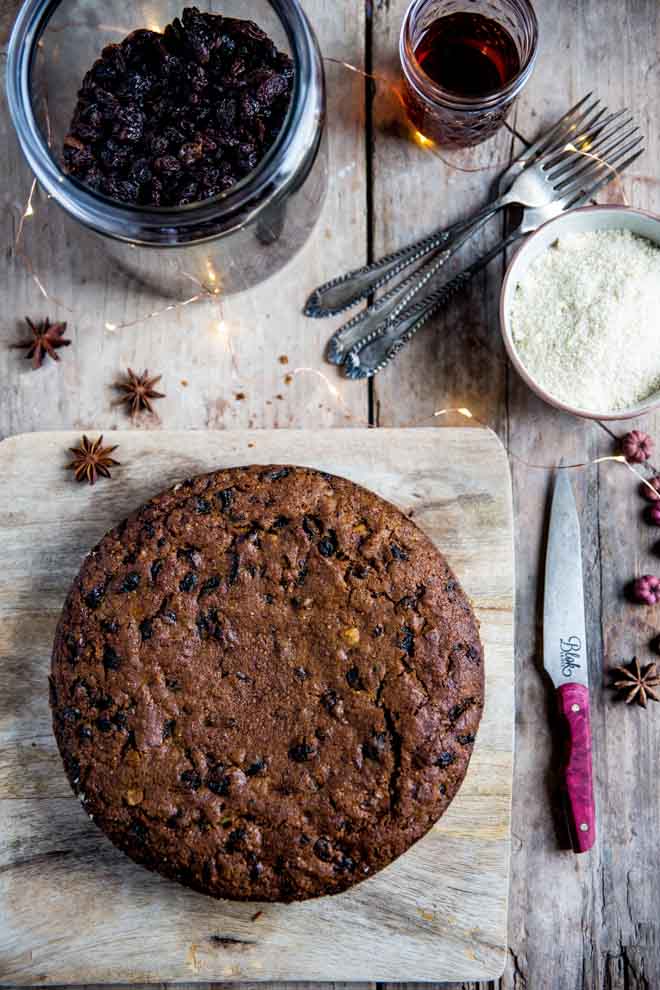 A wonderfully indulgent vegan Christmas cake absolutely packed with fruit and spice. It's rich, moist, delicious and deceptively easy to make! #christmascake #veganchristmascake #fruitcake #veganchristmasrecipes #veganchristmas | Recipe on thecookandhim.com
