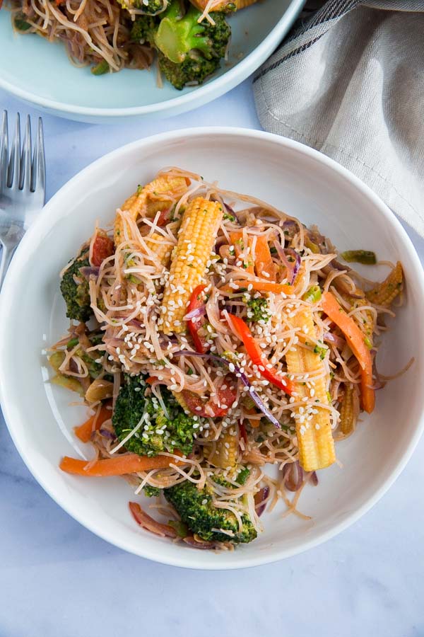 These deliciously easy Sesame Noodles and Veggies are a quick and healthy alternative to take out but taste just as good and can be served hot or cold for an easy weeknight meal or lunch! #sesamenoodles #veggienoodles #coldsesamenoodles #vegetablelowmein #vegetablechowmein | Recipe on thecookandhim.com