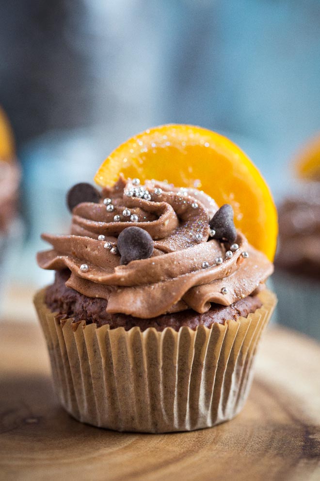 Deliciously fudgy dairy and egg free Chocolate Orange Cupcakes with fluffy chocolate buttercream frosting. You'd never know these are vegan! #veganbaking #veganrecipes #vegancupcakes #veganfrosting #veganbuttercream | Recipe on thecookandhim.com