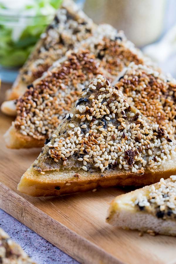 Homemade and sizzled to crispy, golden perfection, this vegan sesame prawn toast recipe is even better than its more traditional counterpart! #sesametoast #chinesefood #veganrecipes #veganchinesefood #asianfood #fakeaway | Recipe on thecookandhim.com