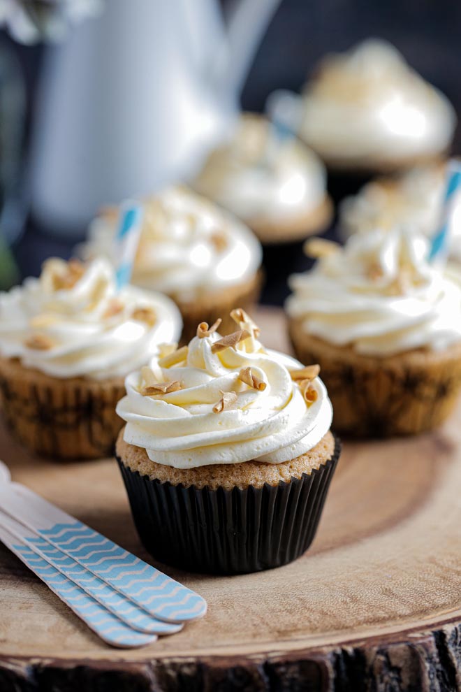 Soft, rich and boozy Jack Daniels cupcakes with a swirl of cola flavoured buttercream frosting. Vegan, easy and deliciously decadent! #vegancupcakes #jackdaniels #whisky #veganrecipes #veganbuttercream #whiskycupcakes #cupcakes | Recipe on thecookandhim.com