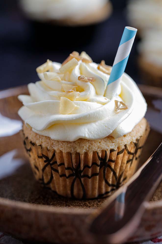 Soft, rich and boozy Jack Daniels cupcakes with a swirl of cola flavoured buttercream frosting. Vegan, easy and deliciously decadent! #vegancupcakes #jackdaniels #whisky #veganrecipes #veganbuttercream #whiskycupcakes #cupcakes | Recipe on thecookandhim.com