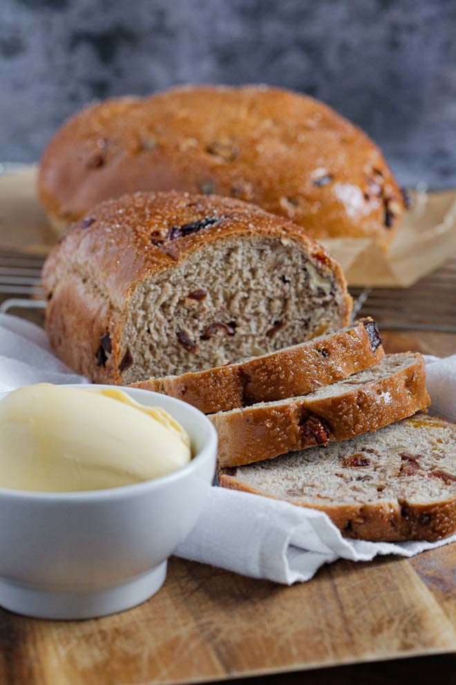 Get the kettle on and the tea cosies out because this spiced fruit loaf makes a wonderful breakfast or afternoon treat, slathered in butter and enjoyed fresh and warm or toasted the next day! #fruitloaf #fruitbread #homemadebread #veganbread #spicedbread #christmasbread | Recipe on the cookandhim.com