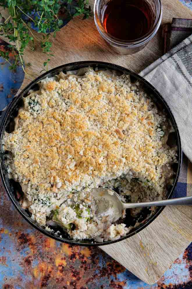 A super simple make ahead vegan sprout gratin brimming with flavour. The perfect seasonal side dish of creamy sprouts, chestnuts and vegan ham and a crispy herb breadcrumb topping #sprouts #brusselssprouts #sproutrecipes #veganrecipes #veganchristmas #vegansides #vegansidedishes | Recipe on thecookandhim.com