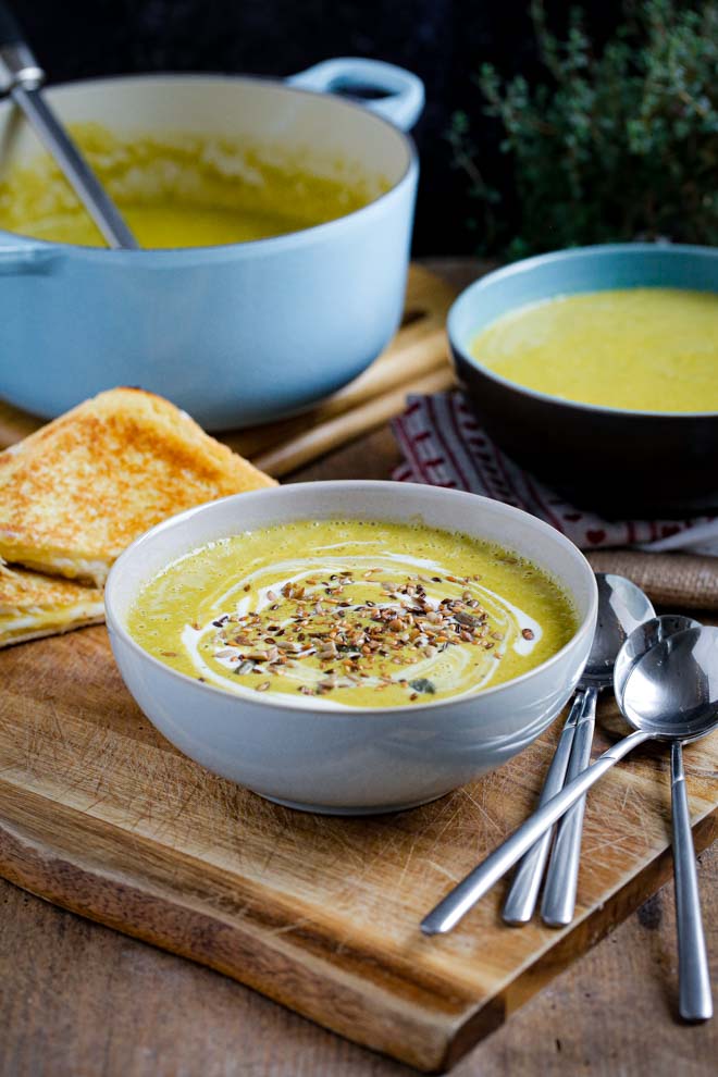 Healthy broccoli soup packed with veggies, a dash of wine and cream and tonnes of flavour! So simple but rich and satisfying this velvety vegan soup is made in just one pan in around 30 minutes! Serve with toasted vegan cheese sandwiches for comfort food heaven! #veganrecipes #vegansoup #broccolisoup #creamybroccolisoup #recipe #healthysoup #plantbased #dairyfree | Recipe on thecookandhim.com