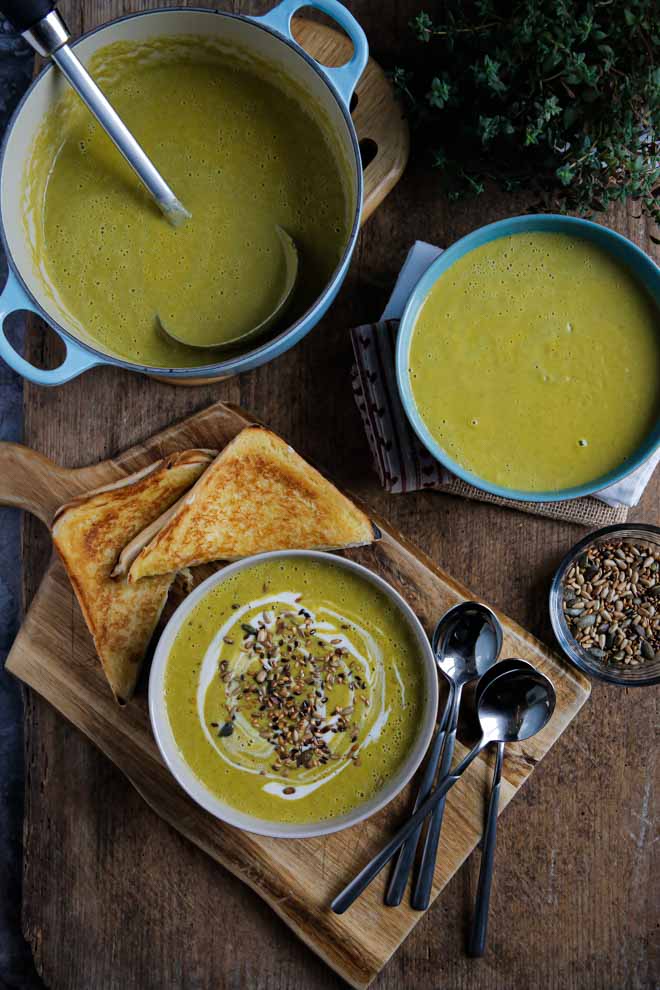 Healthy broccoli soup packed with veggies, a dash of wine and cream and tonnes of flavour! So simple but rich and satisfying this velvety vegan soup is made in just one pan in around 30 minutes! Serve with toasted vegan cheese sandwiches for comfort food heaven! #veganrecipes #vegansoup #broccolisoup #creamybroccolisoup #recipe #healthysoup #plantbased #dairyfree | Recipe on thecookandhim.com
