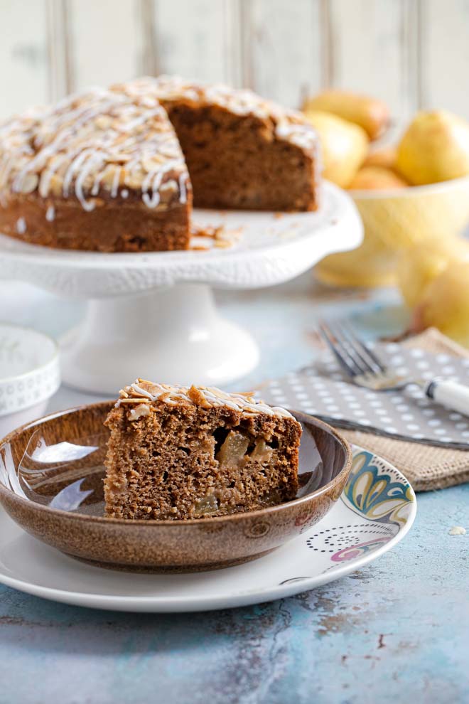 This delightful pear and almond cake is my take on an Italian classic - a light sponge brimming with fresh fruit and studded with crisp almonds. It's just as good on a rainy day with a cuppa tea as it is with a fancy quenelle of cream for an elegant dinner party! #vegancake #veganbaking #italiancake #pears #almonds #pearandalmondcake #plantbased #eggfreecake #dairyfree | Recipe on thecookandhim.com