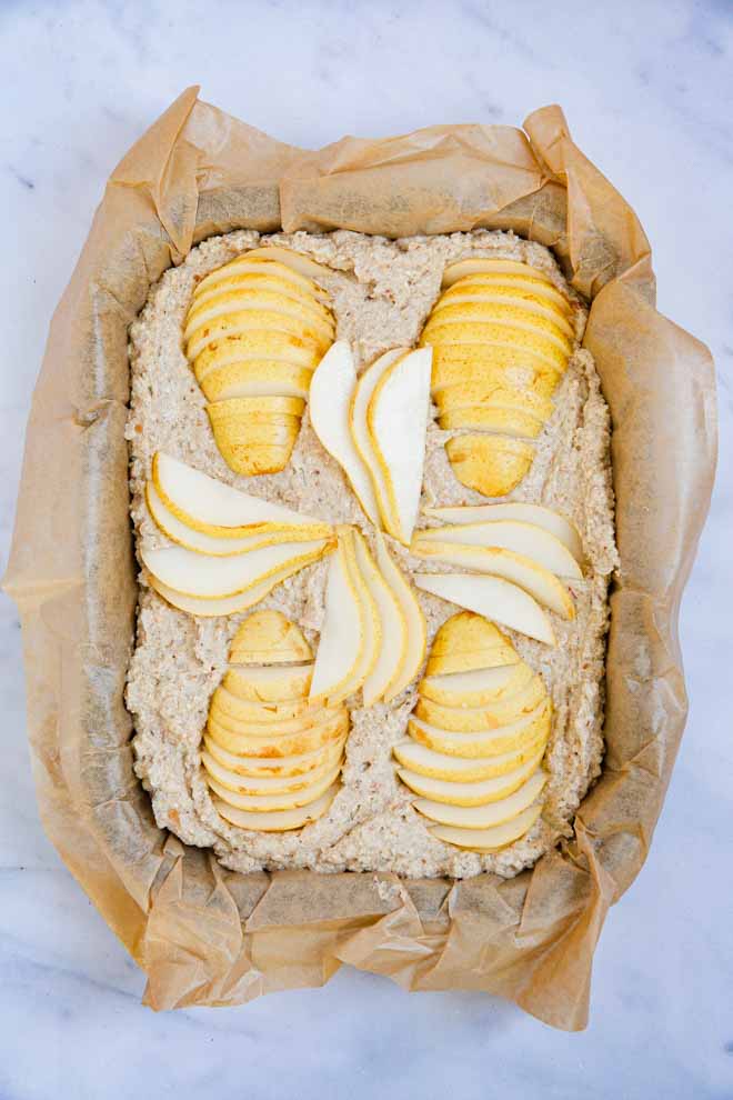 A cross between breakfast and dessert this vegan fruit bowl bake is packed full of tasty ingredients and super simple to whip up! Make ahead for a speedy breakfast or snack or enjoy warm from the oven for a leisurely weekend brunch! #bakedoats #dessertforbreakfast #oatmeal #veganbreakfast #glutenfree #dairyfree #oats #snackideas #proteinbreakfast | Recipe on thecookandhim