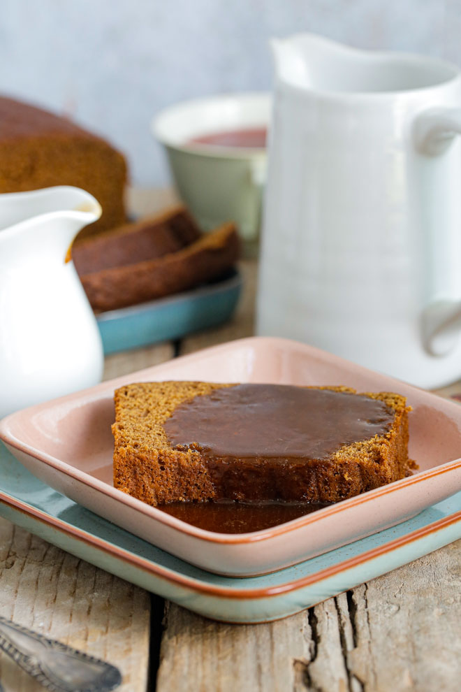 Soft and squidgy, this Jamaican Ginger Cake is made extra special with a velvety sweet toffee sauce, turning a deliciously humble cake into an epic sticky pudding! #jamaicangingercake #vegancake #veganbaking #stickycake #stickytoffeepudding #veganrecipe #vegantoffeesauce | Recipe on thecookandhim.com