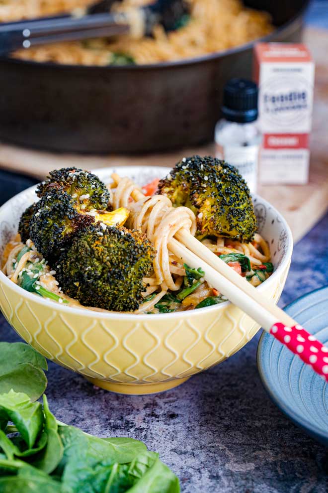 An Asian inspired recipe that's full of flavour and so easy to make. Fresh veggies in a rich, creamy, spicy Thai coconut sauce served with soft noodles for perfect weeknight comfort food! #thiafood #vegan #thaicurry #curry #noodles #redcurry #vegancurry | Recipe on thecookandhim.com