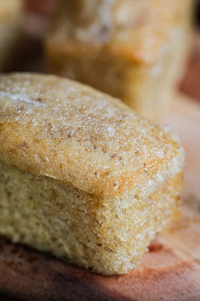 Dinky little vegan lemon drizzle mini loaf cakes. Full of zesty flavour with a sticky sweet lemon drizzle. Perfect lunchbox, picnic or because it's Tuesday sweet treats! #vegan #miniloafcakes #lemondrizzle #lemondrizzlecake #veganbaking #eggfreebaking #eggfreecake #dairyfree