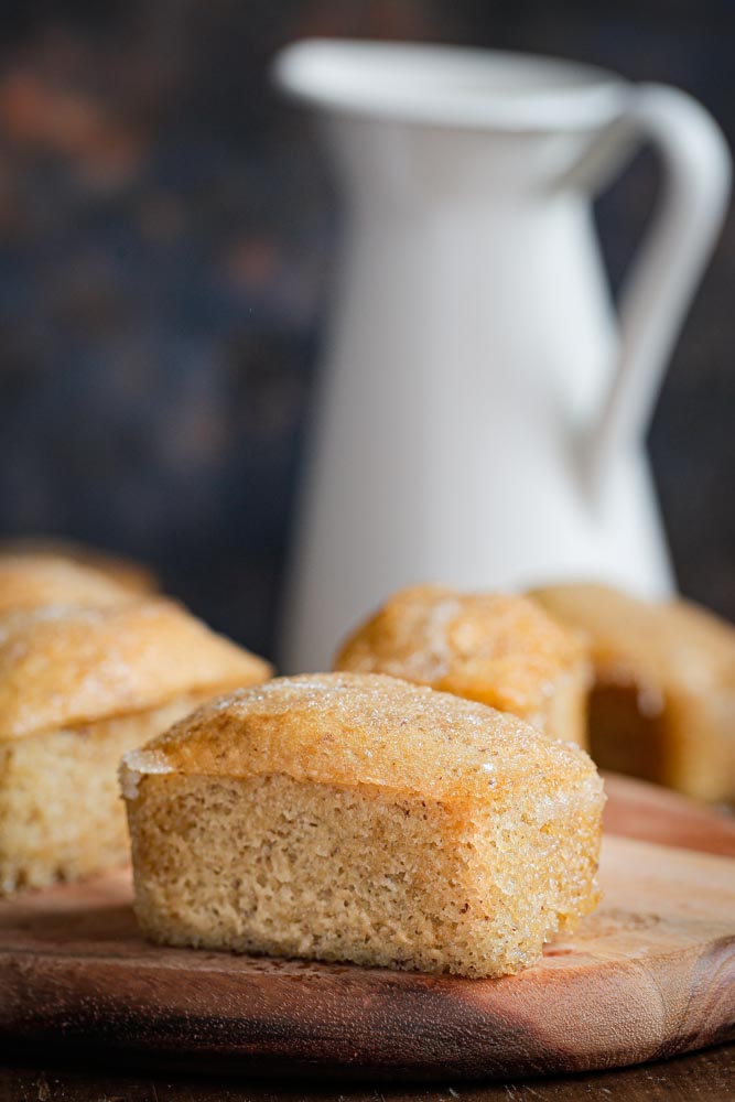 Dinky little vegan lemon drizzle mini loaf cakes. Full of zesty flavour with a sticky sweet lemon drizzle. Perfect lunchbox, picnic or because it's Tuesday sweet treats! #vegan #miniloafcakes #lemondrizzle #lemondrizzlecake #veganbaking #eggfreebaking #eggfreecake #dairyfree
