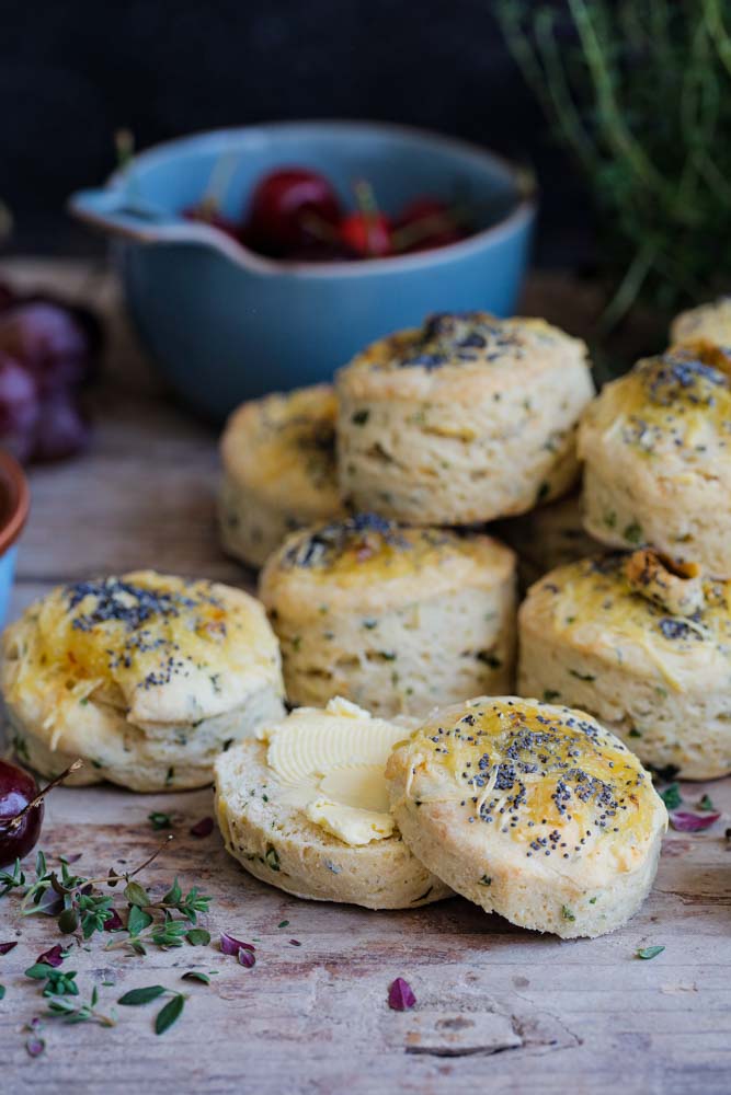 Light and fluffy vegan Smoked Applewood Cheese and Herb Scones that are just as delicious warm or cold. An easy to follow recipe, perfect for picnics, lunchboxes, savoury snack or serve alongside a hearty stew. Just split in half and serve with lashings of butter! Recipe on thecookandhim.com | #scones #vegan #veganscones #savouryscones #veganbaking #vegancheese