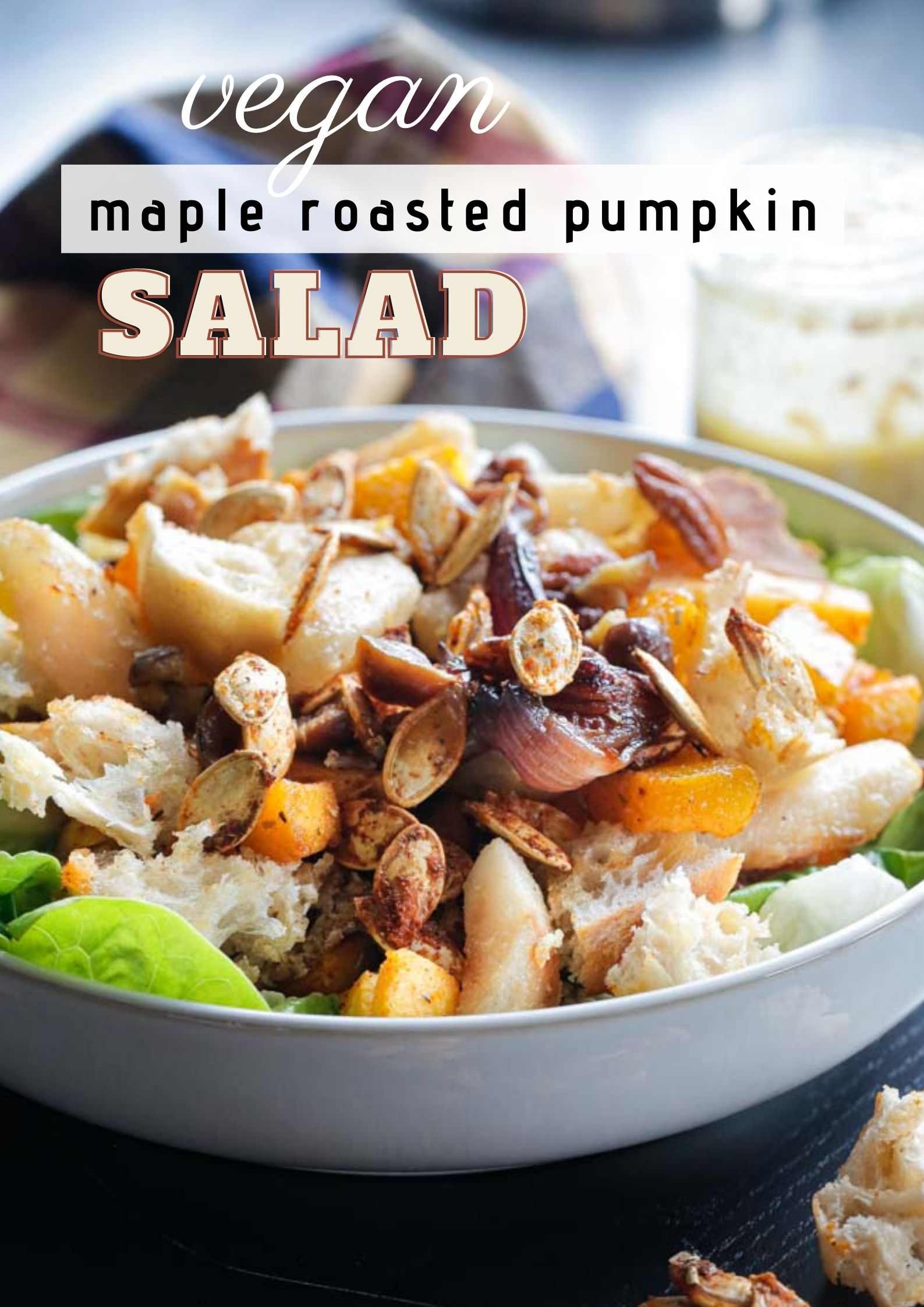 Drizzled with a light tahini dressing this fully loaded pumpkin salad with warm pears, toasted pecans, crisp croutons and spiced pumpkin seeds is everything a salad should be! Recipe on thecookandhim.com #roastedpumpkin #pumpkinrecipes #pumpkinsalad #vegan #tahini #roastedvegsalad #warmsalad