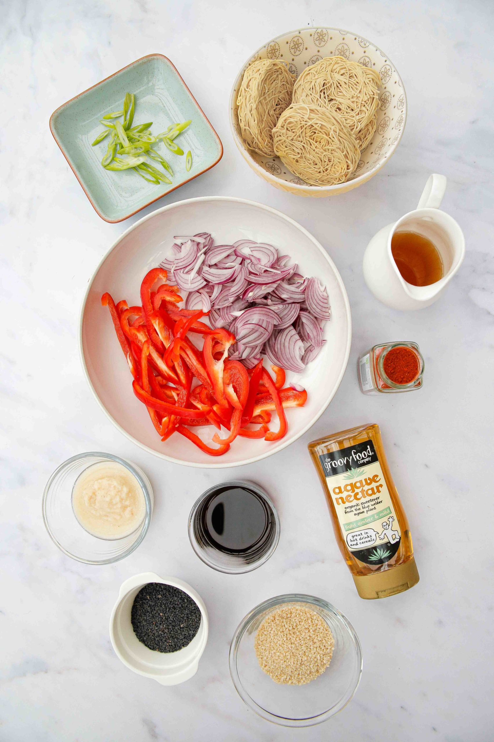 These garlic sesame noodles are healthy, vegan and take just 15 minutes to make! And with just a few store cupboard ingredients they're perfect for busy days | Recipe on thecookandhim.com #noodles #vegan #recipe #sesamegarlicnoodles #sesamenoodles #chowmein #stirfry #easydinner #easymeal #easymealideas