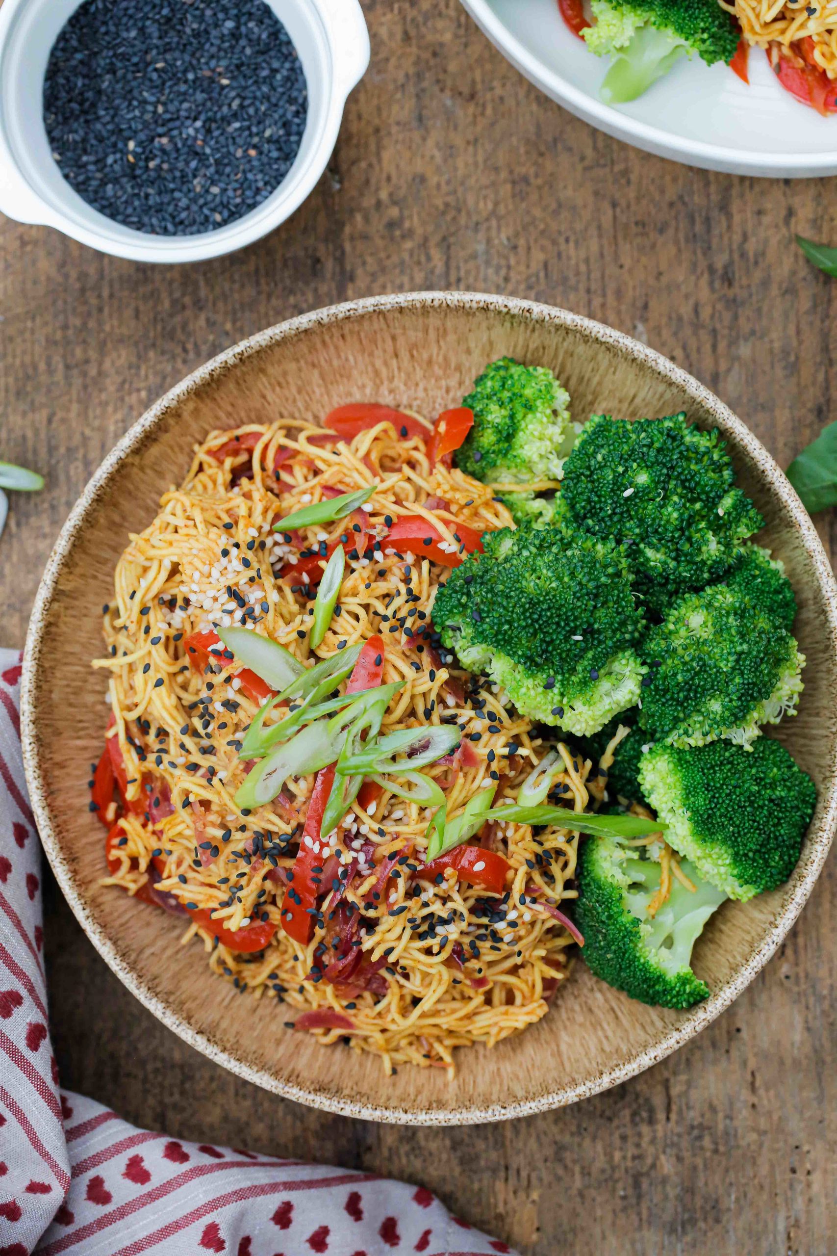 These garlic sesame noodles are healthy, vegan and take just 15 minutes to make! And with just a few store cupboard ingredients they're perfect for busy days | Recipe on thecookandhim.com #noodles #vegan #recipe #sesamegarlicnoodles #sesamenoodles #chowmein #stirfry #easydinner #easymeal #easymealideas