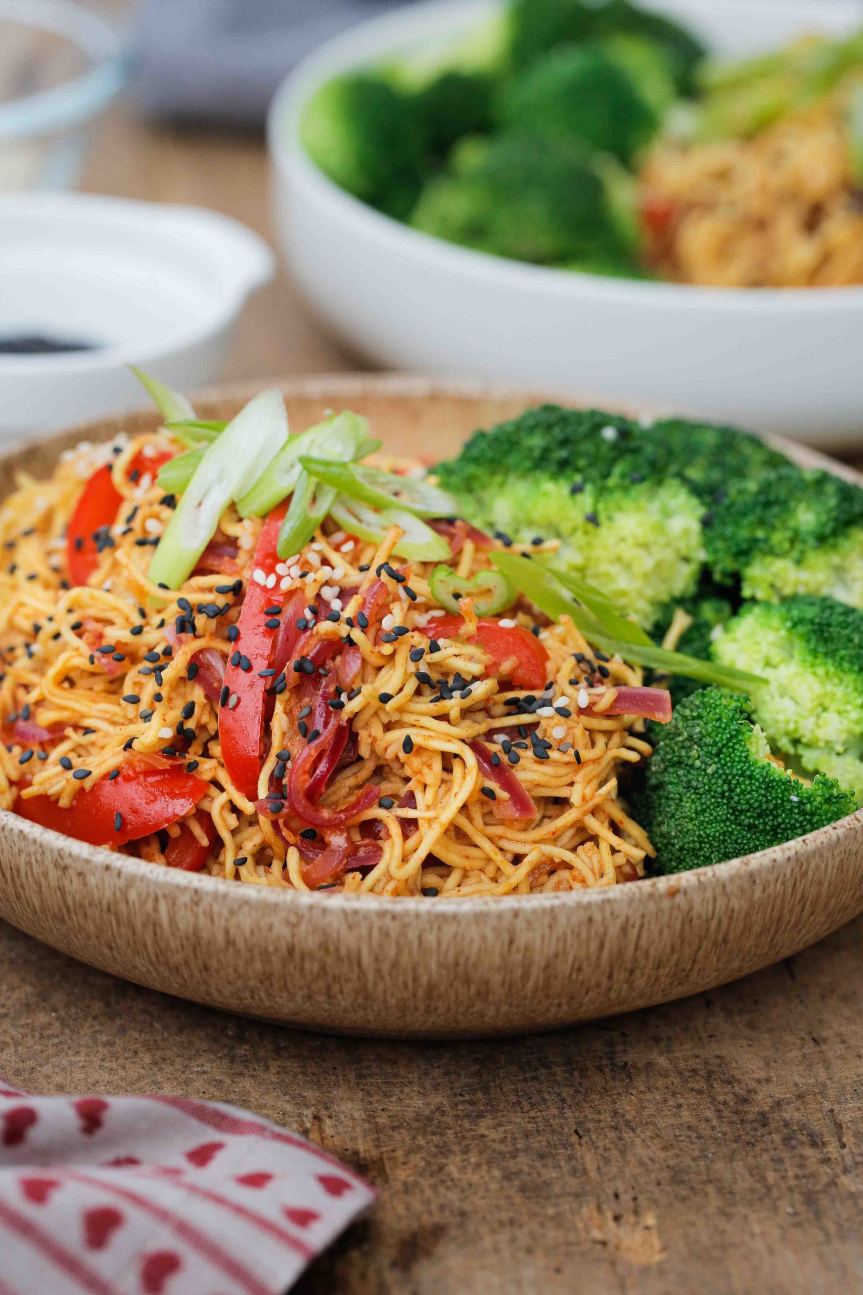 These garlic sesame noodles are healthy, vegan and take just 15 minutes to make! And with just a few store cupboard ingredients they're perfect for busy days | Recipe on thecookandhim.com #noodles #vegan #recipe #sesamegarlicnoodles #sesamenoodles #chowmein #stirfry #easydinner #easymeal #easymealideas