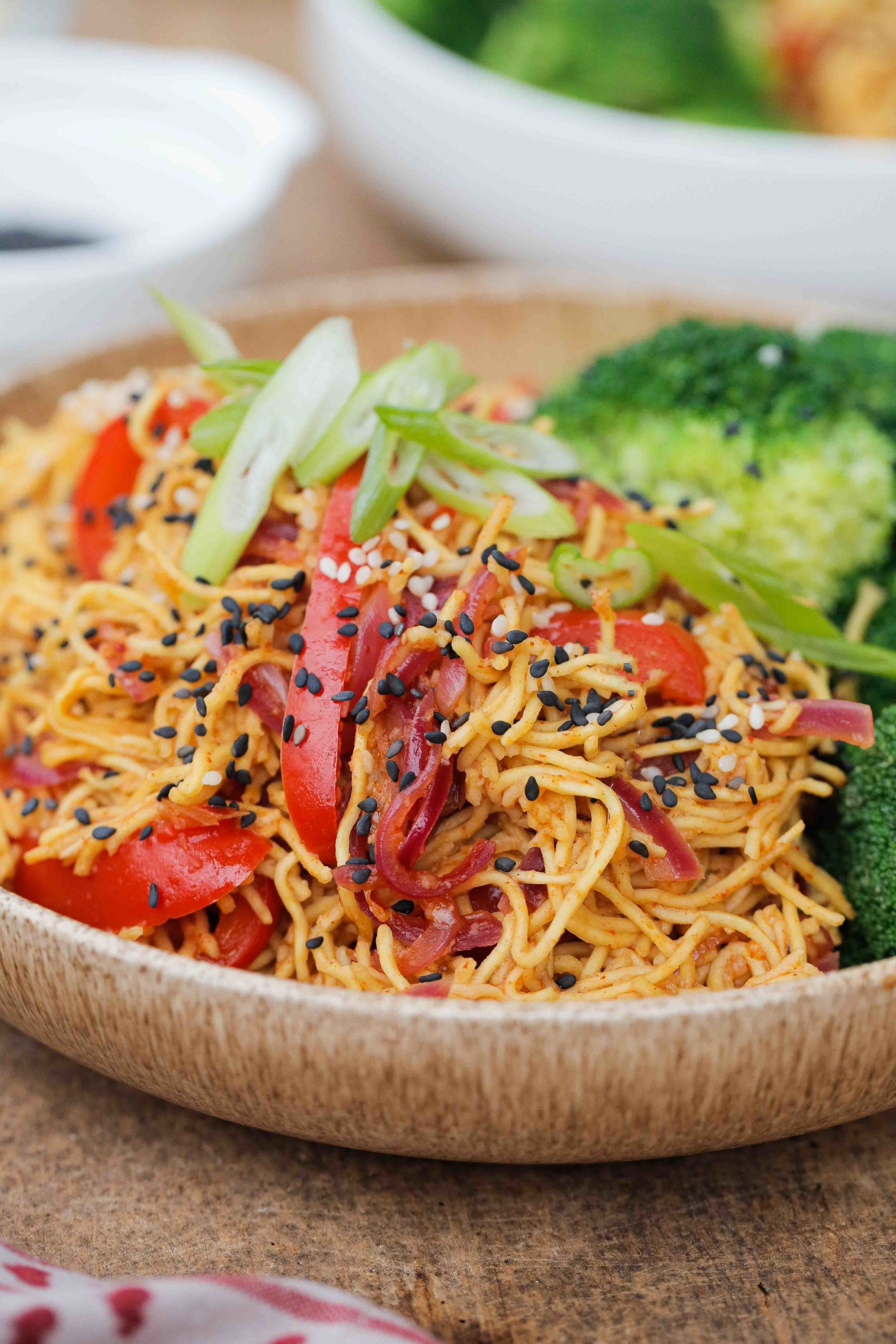 These garlic sesame noodles are healthy, vegan and take just 15 minutes to make! And with just a few store cupboard ingredients they're perfect for busy days | Recipe on thecookandhim.com #noodles #vegan #recipe #sesamegarlicnoodles #sesamenoodles #chowmein #stirfry #easydinner #easymeal #easymealideas