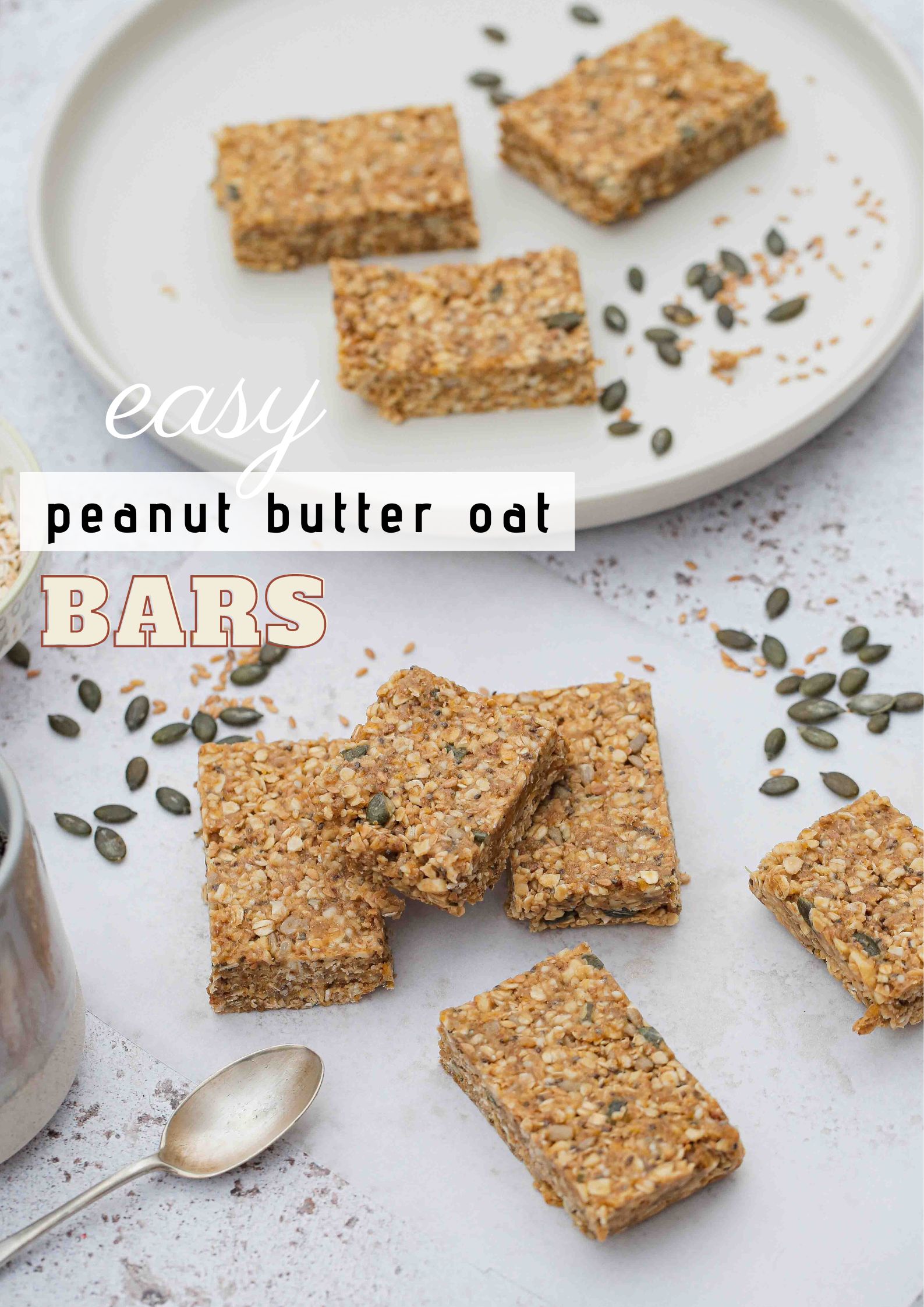 EASY no bake homemade peanut butter oat bars - full of seeds, nuts and dried fruits. Refined sugar free but sweet and chewy and perfect for a quick breakfast or snack! Vegan and gluten free recipe on thecookandhim.com #nobakebars #peanutbutterbars #granolabars