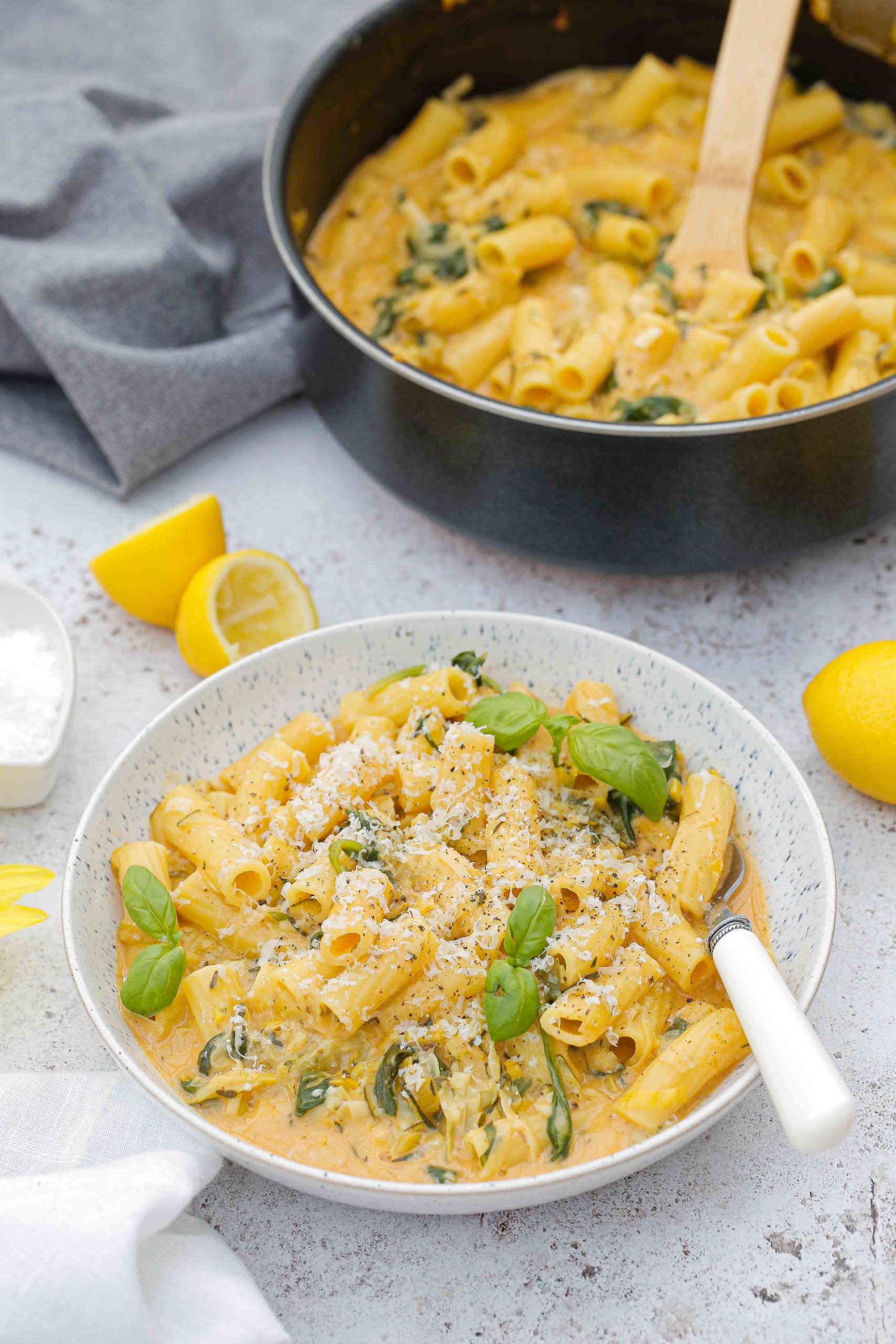 Creamy Lemon Courgette Rigatoni is a wonderful summery pasta. Lots of veggies all cooked in one pan in around 20 minutes for a speedy weeknight meal the whole family can enjoy! Recipe on thecookandhim.com | #summerpasta #pastasauce #veganpasta #courgettepasta #rigatoni #creamypastasauce #lemonpasta