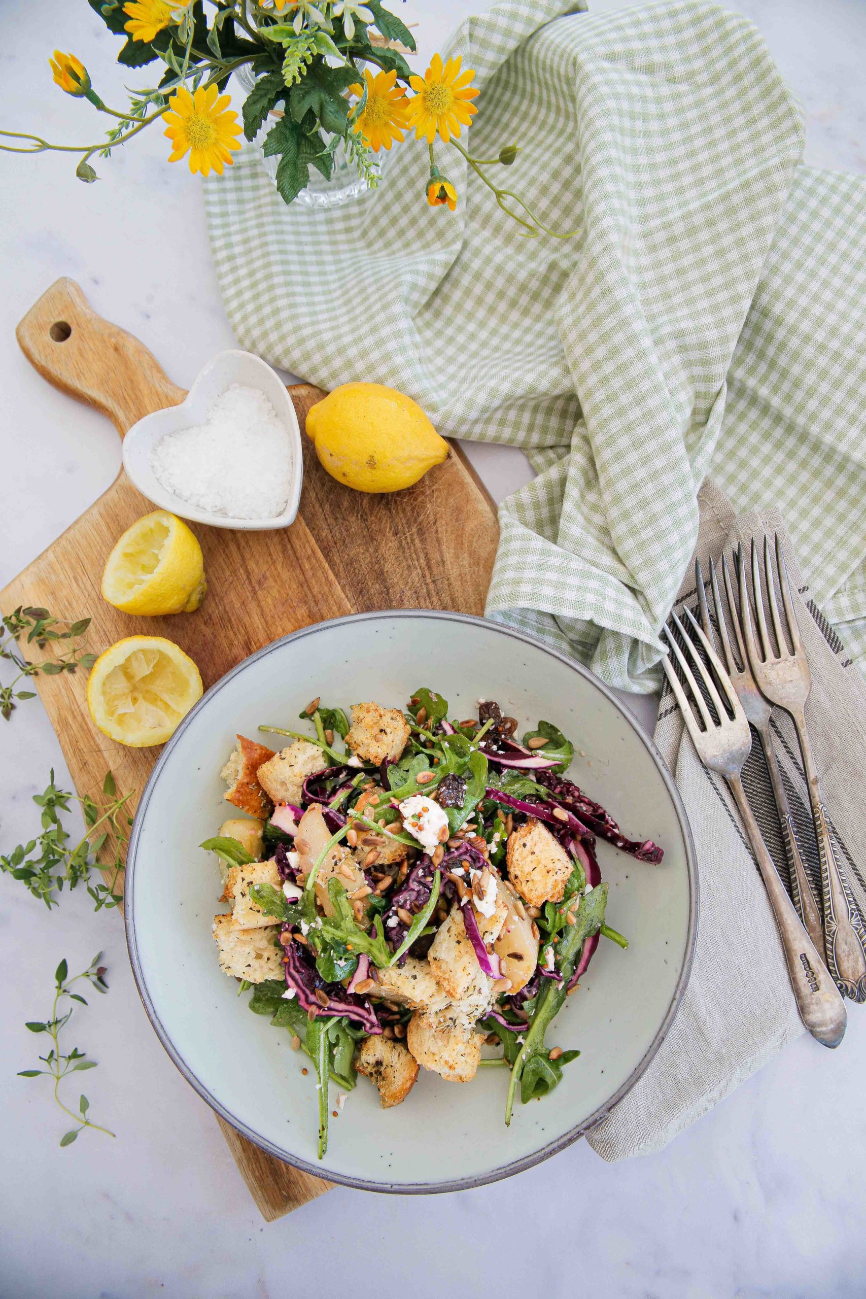 This pear salad will easily become a seasonal favourite! Made with roasted pears, red cabbage, homemade croutons and a tangy mustard dressing. Recipe on thecookandhim.com #pearsalad #redcabbage #arugula #rocket #stalebread #homemadecroutons