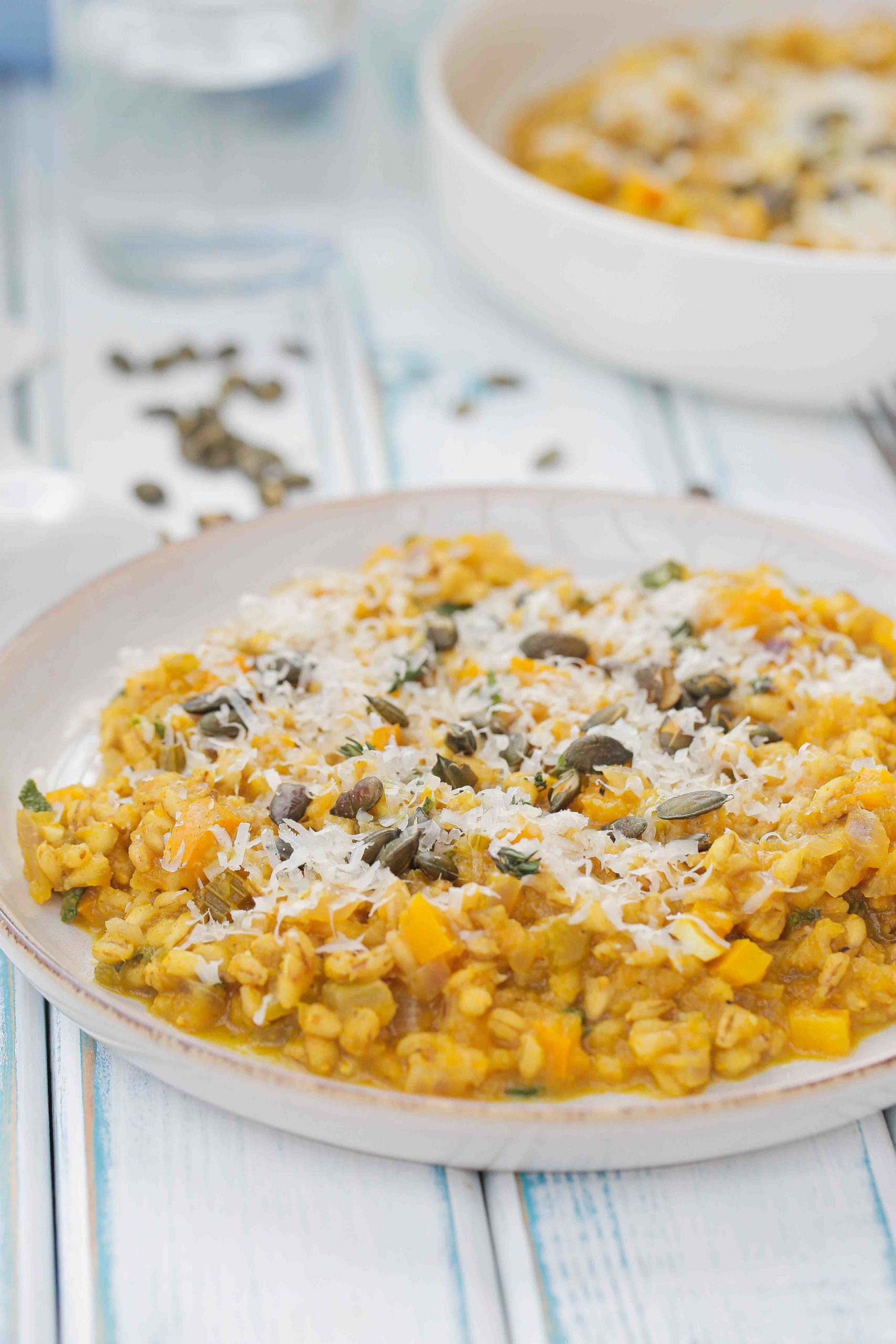 Easy, creamy, one pan pumpkin risotto with white wine, sage and pearl barley. Delicious autumn comfort food. Recipe on thecookandhim.com | #pumpkinrisotto #pearlbarley #vegan #autumnrecipes #comfortfoodrecipes #onepotrecipes #winterwarmerrecipes