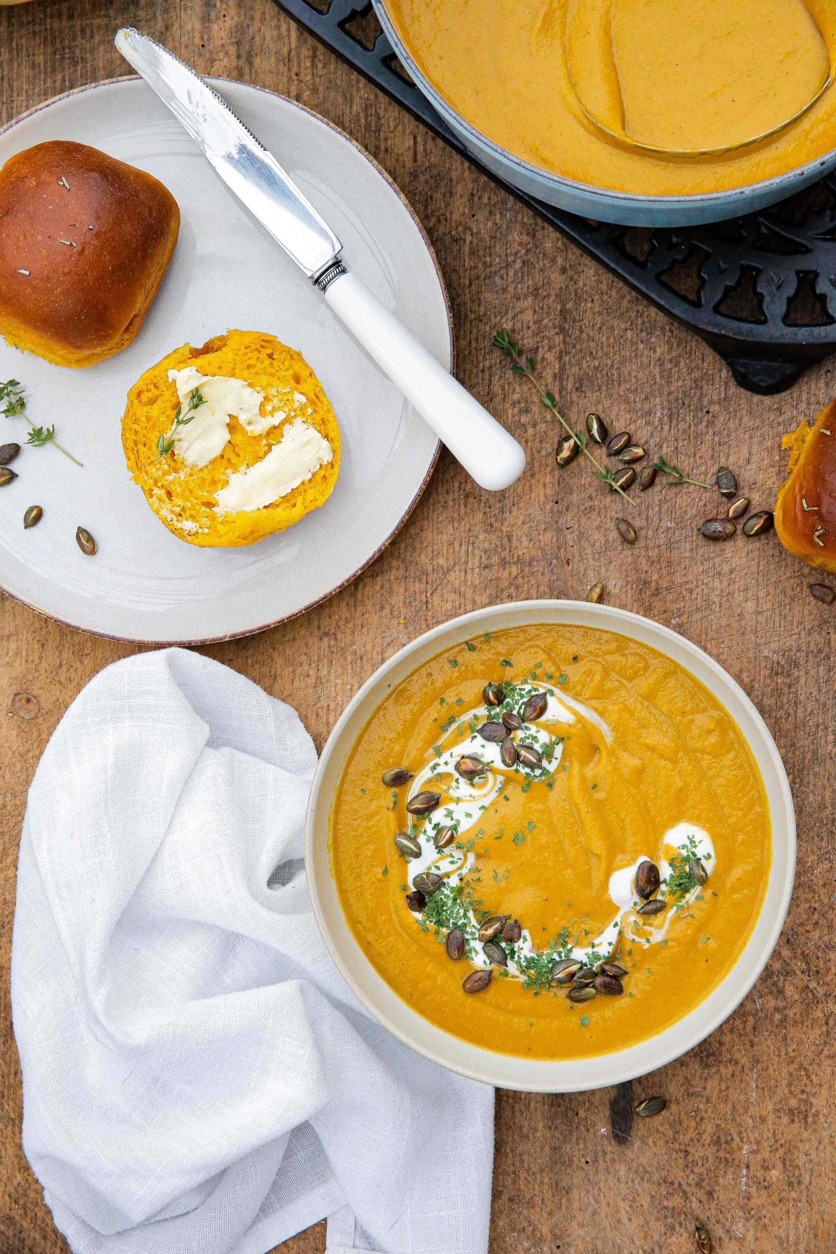 Easy to make but tastes amazing, this pumpkin soup with herbs, garlic and extra veggies is the perfect healthy bowl to warm you up during the chilly months! Recipe on thecookandhim.com #pumpkinsoup #pumpkinrecipes #autumnrecipes #winterwarmerrecipes #prepaheadmeals #fallrecipes