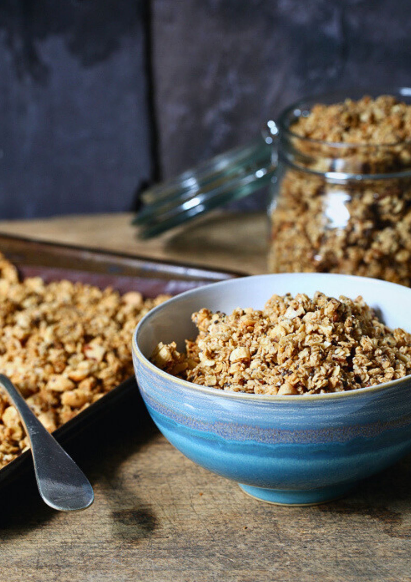 This healthy homemade peanut butter granola loaded with chopped nuts and dark chocolate chips is the perfect make ahead breakfast or quick snack! Sugar free and gluten free too! Recipe on thecookandhim.com | #granola #homemadegranola #healthygranola #sugarfreebreakfast