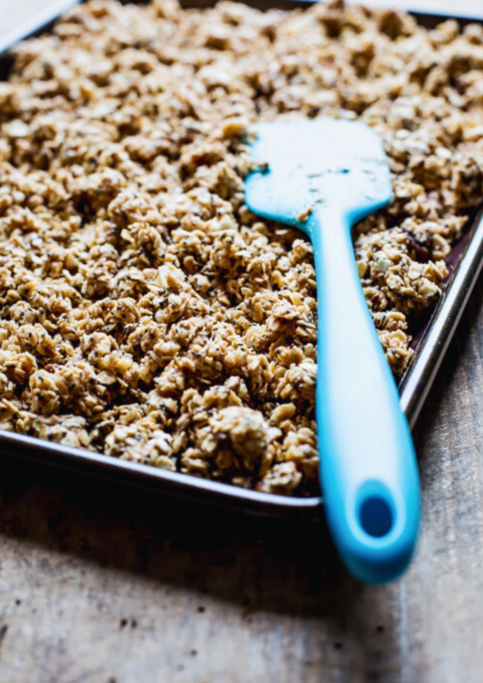This healthy homemade granola made with chopped nuts, peanut butter and dark chocolate chips is the perfect make ahead breakfast or quick snack! Sugar free and gluten free too! Recipe on thecookandhim.com | #granola #homemadegranola #healthygranola #sugarfreebreakfast