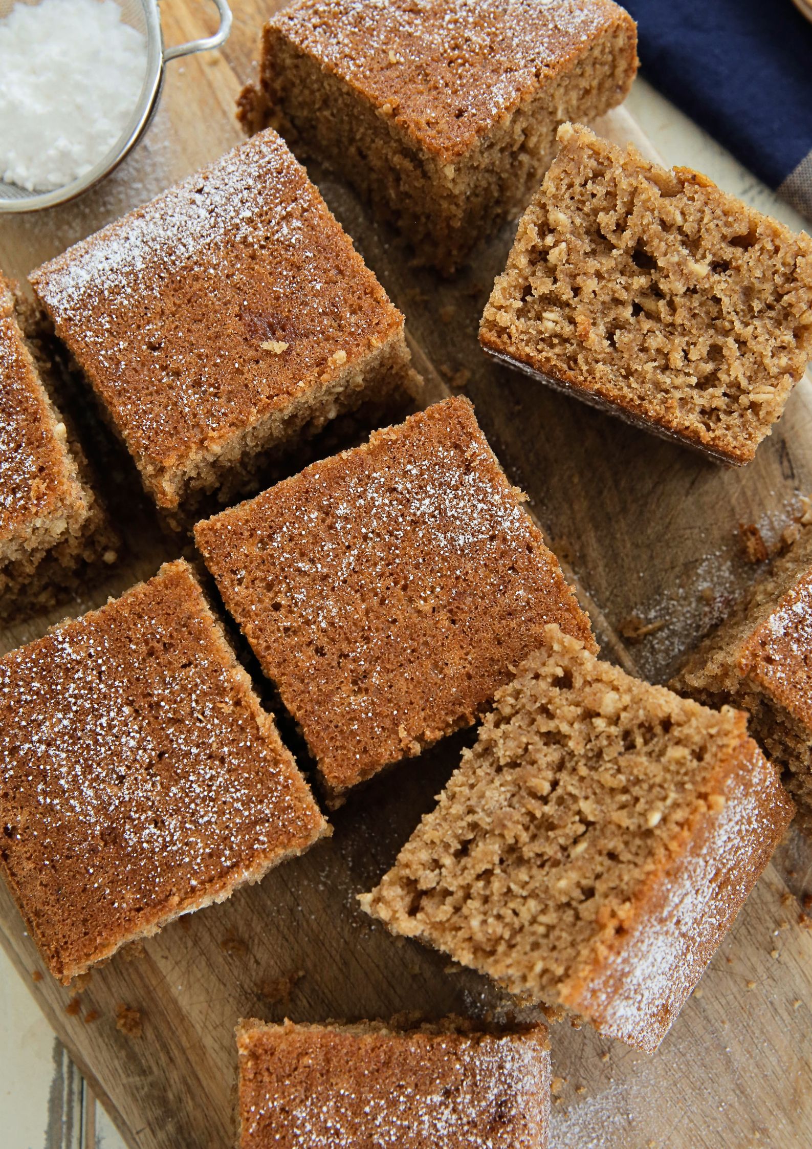 A traditional cake often made for Bonfire Night celebrations in the UK, Parkin is a deliciously moist spiced ginger cake made with oats and dark brown sugar | Recipe on the cookandhim.com #vegancake #bonfirenightfood #parkin #gingercake #spicecake