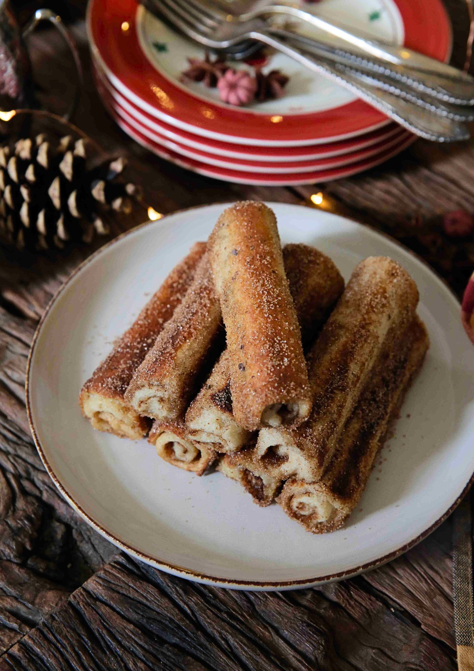 All the sugary, buttery flavours of French toast - in a roll! These easy to make cinnamon toast roll ups are a decadent treat, perfect for a weekend or Christmas breakfast or just when you fancy spoiling yourself. Recipe on thecookandhim.com #frenchtoast #cinnamontoast #christmasbreakfastideas #christmasbreakfast #veganchristmas