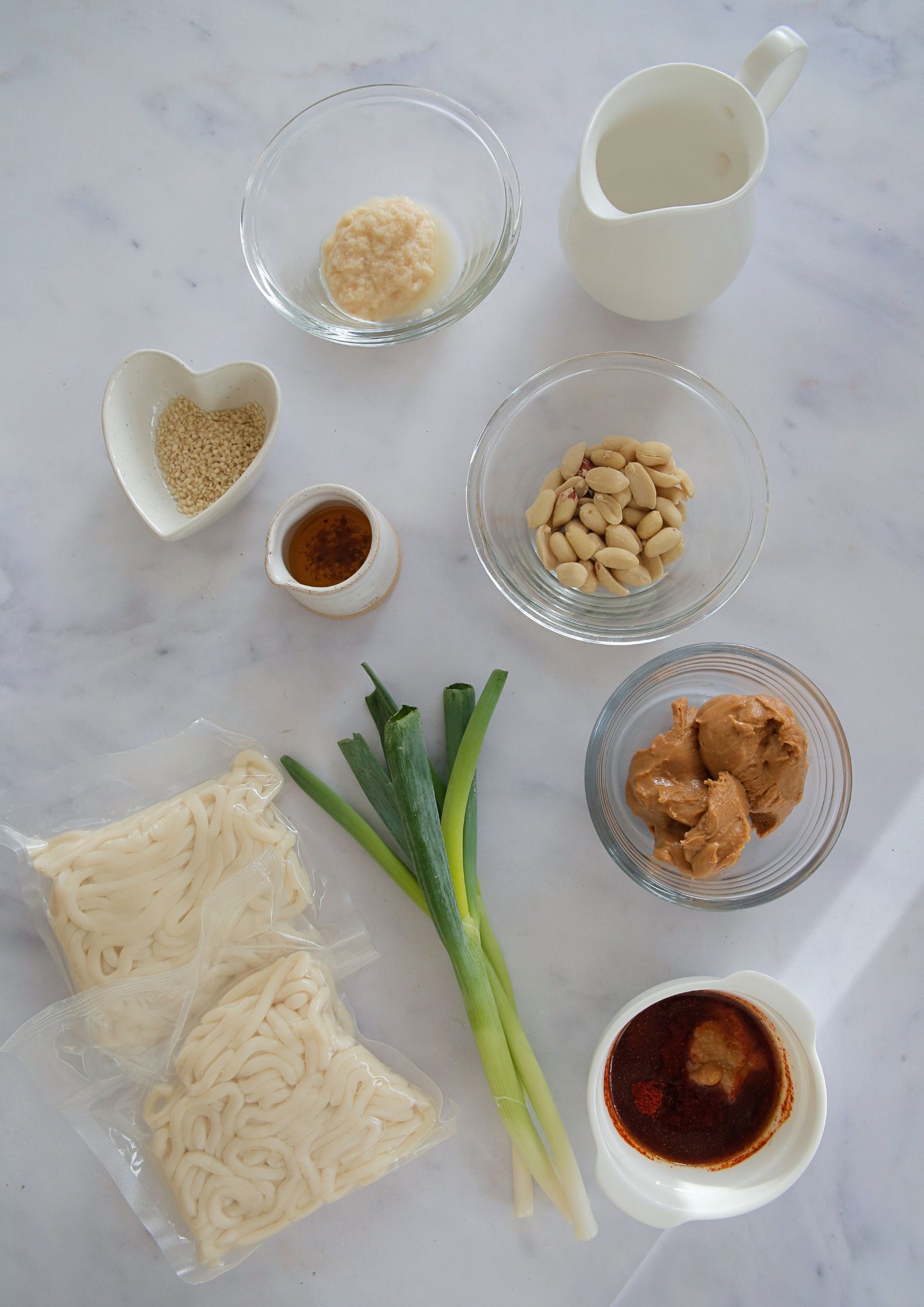 Perfect for when you're hungry but short on time to cook, these peanut noodles are gently spiced but full of rich flavour. An easy meal for any night of the week! Full recipe on thecookandhim.com | #peanutnoodles #spicynoodles #peanutbutternoodles #easydinnerideas