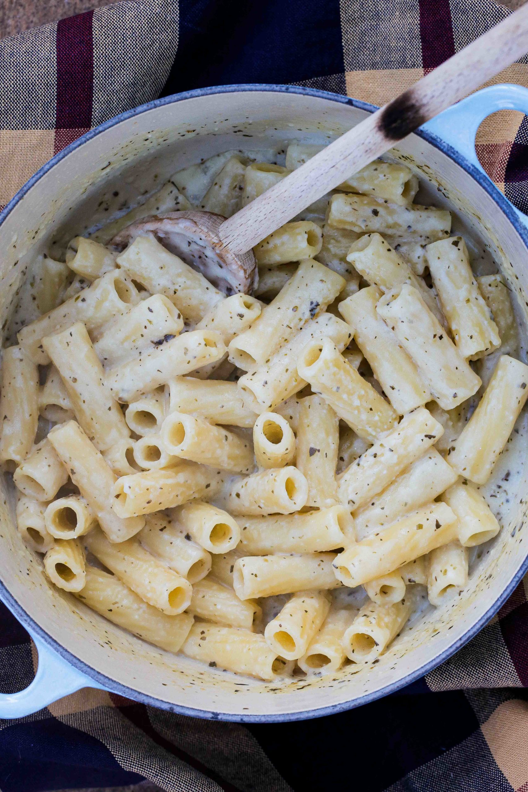 Beautifully creamy vegan pasta Alfredo - no nuts, no cauliflower, just simple pantry ingredients all cooked in one pan for a deliciously easy meal! Recipe on thecookandhim.com | #pastaalfredo #veganpastasauce #veganpastaalfredo #easy #dinnerrecipes