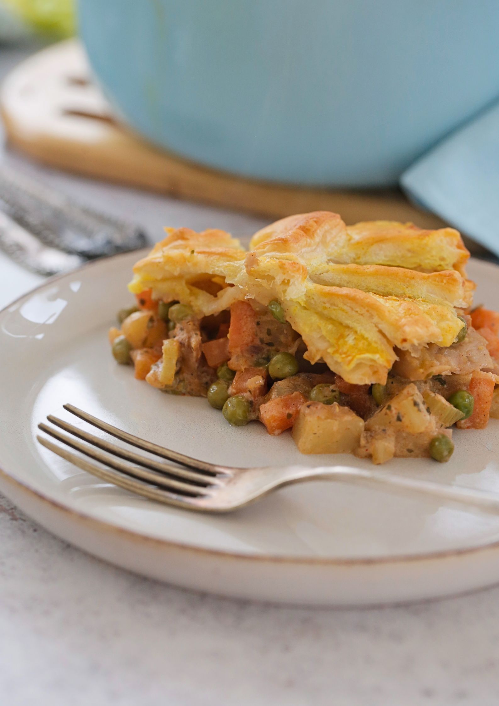 A comfort food classic made vegan! This chicken pot pie packed with veggies and topped with flaky pastry is an easy one pan meal that's absolutely full of flavour. It's also perfect for making ahead and a real family favourite! Recipe on thecookandhim.com | #veganpotpie #meatfree #veganchicken #easyveganmeal #onepanmeal #vegandinner