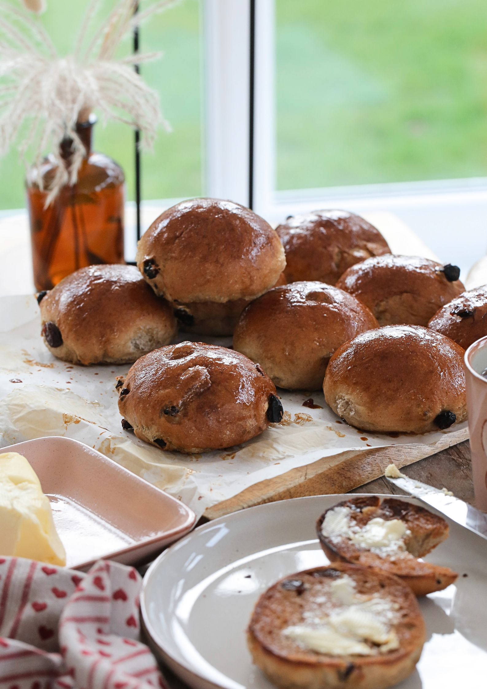 An old fashioned English teacake recipe that is so easy to recreate at home. These delicious vegan fruit teacakes are lightly spiced sweet buns, best enjoyed toasted with lashings of butter #Teacakes #AfternoonTea #Baking #Vegan