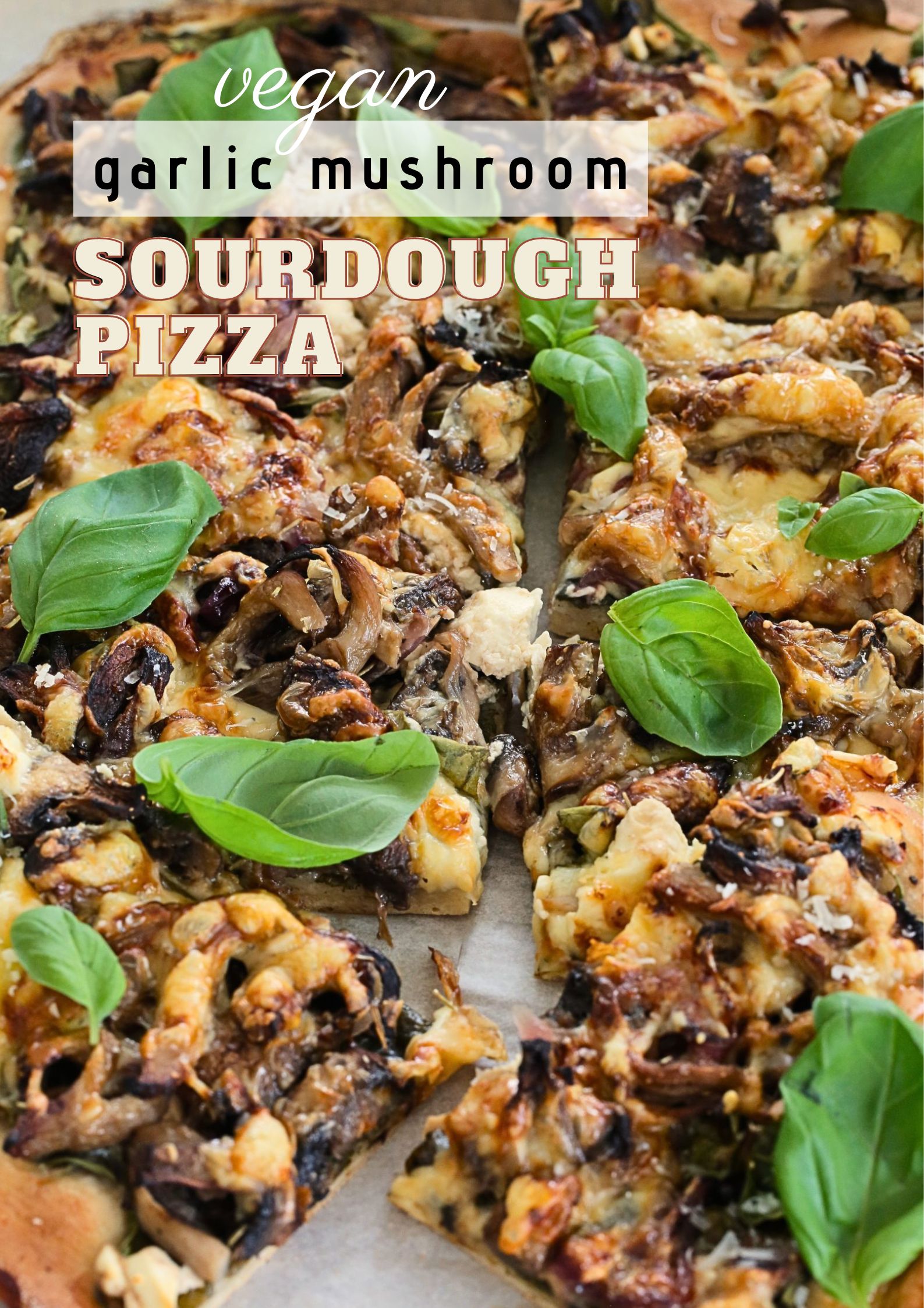 Soft, chewy, and cheesy, this garlic mushroom sourdough pizza is the perfect recipe for pizza night. Loaded with herby garlic mushrooms, spinach and two types of vegan cheese this will be a new family favourite! #veganpizza #sourdough #sourdoughpizza #vegancheese