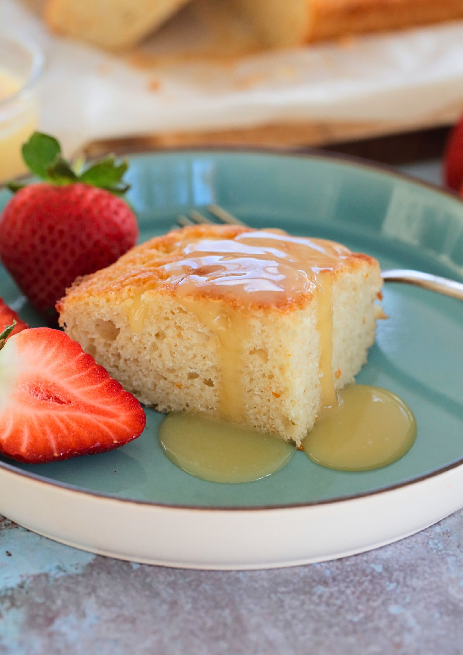 If you're a fan of oranges and lemons you're going to love this light and fluffy vegan St Clements curd cake with its sunshine flavours! A moist vegan sponge rippled with homemade curd, perfect with an afternoon cuppa or add a dollop of whipped cream for delicious dessert #vegancakerecipes #veganrecipes #vegandessert #orangecake #lemoncake