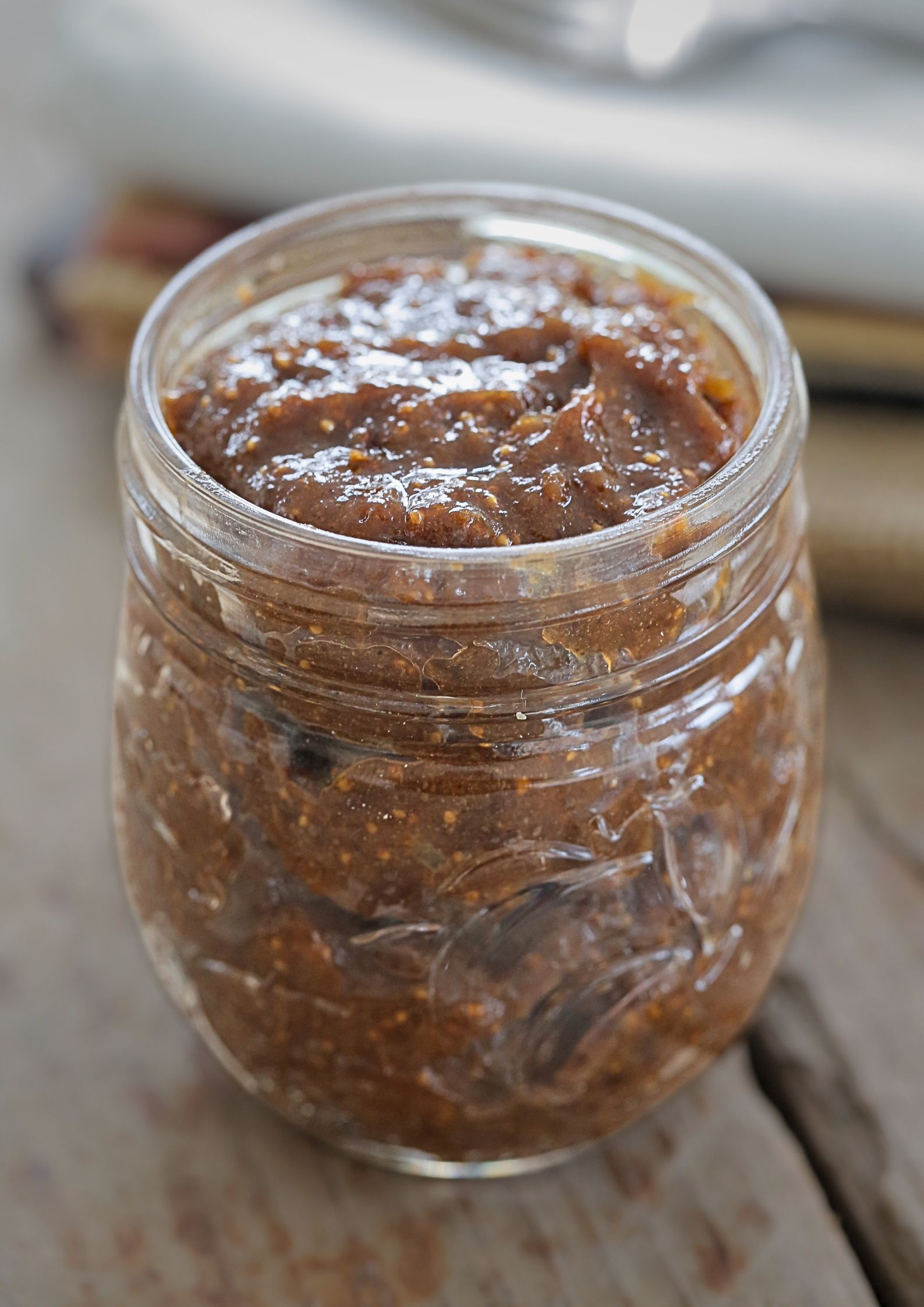 Clear glass jar filled with spiced fig jam