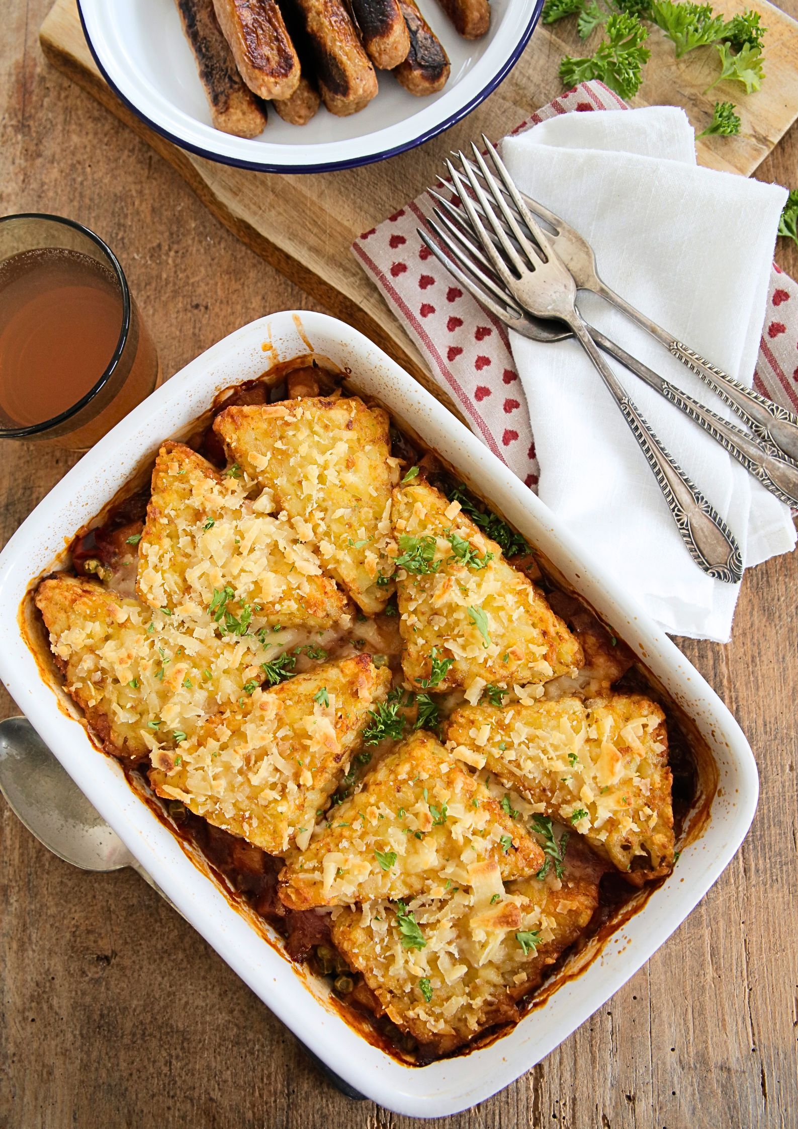 Packed with veggies in a rich and spicy tomato and gochujang sauce, topped with hash browns and baked to crispy perfection this is easy, hearty and warming comfort food.