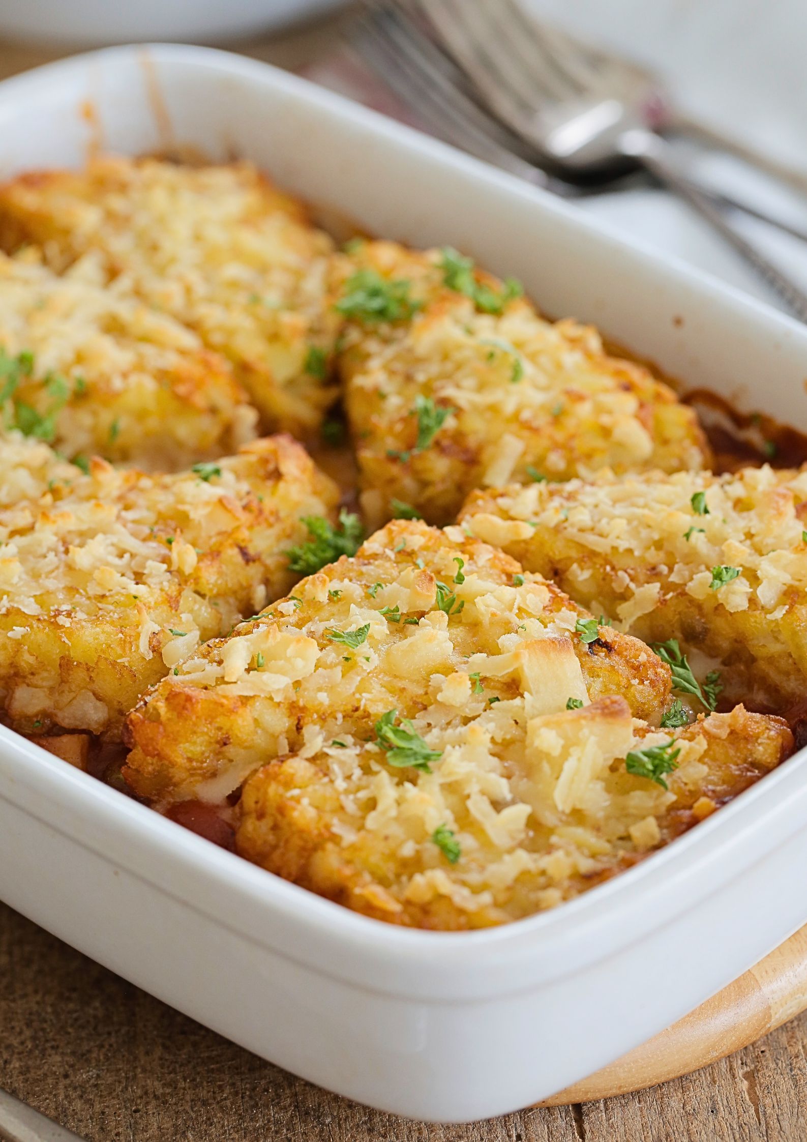 Packed with veggies in a rich and spicy tomato and gochujang sauce, topped with hash browns and baked to crispy perfection this is easy, hearty and warming comfort food.