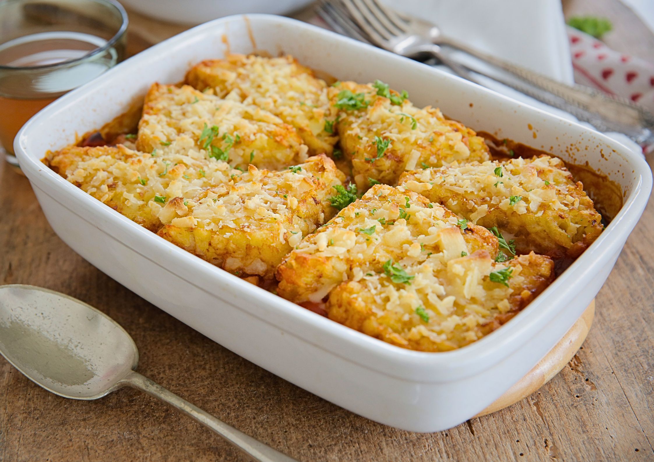 Packed with veggies in a rich and spicy tomato and gochujang sauce, topped with hash browns and baked to crispy perfection this is easy, hearty and warming comfort food.