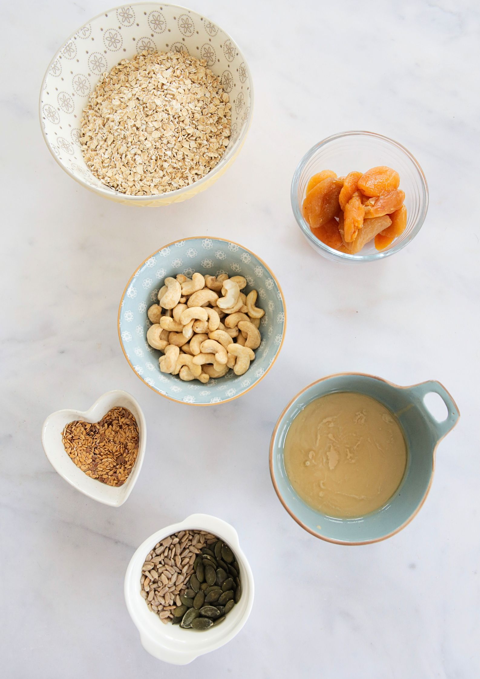 This apricot and tahini granola packed with rich, nutty flavour and naturally sweet dried fruit is totally vegan and gluten free. Perfect for sprinkling over yoghurt or porridge, enjoying with plant milk, or snacking straight from the jar. The blend of nuts, seeds, and oats makes it a nutritious choice as it's also refined sugar free, making it a guilt-free treat you can enjoy any time of day.