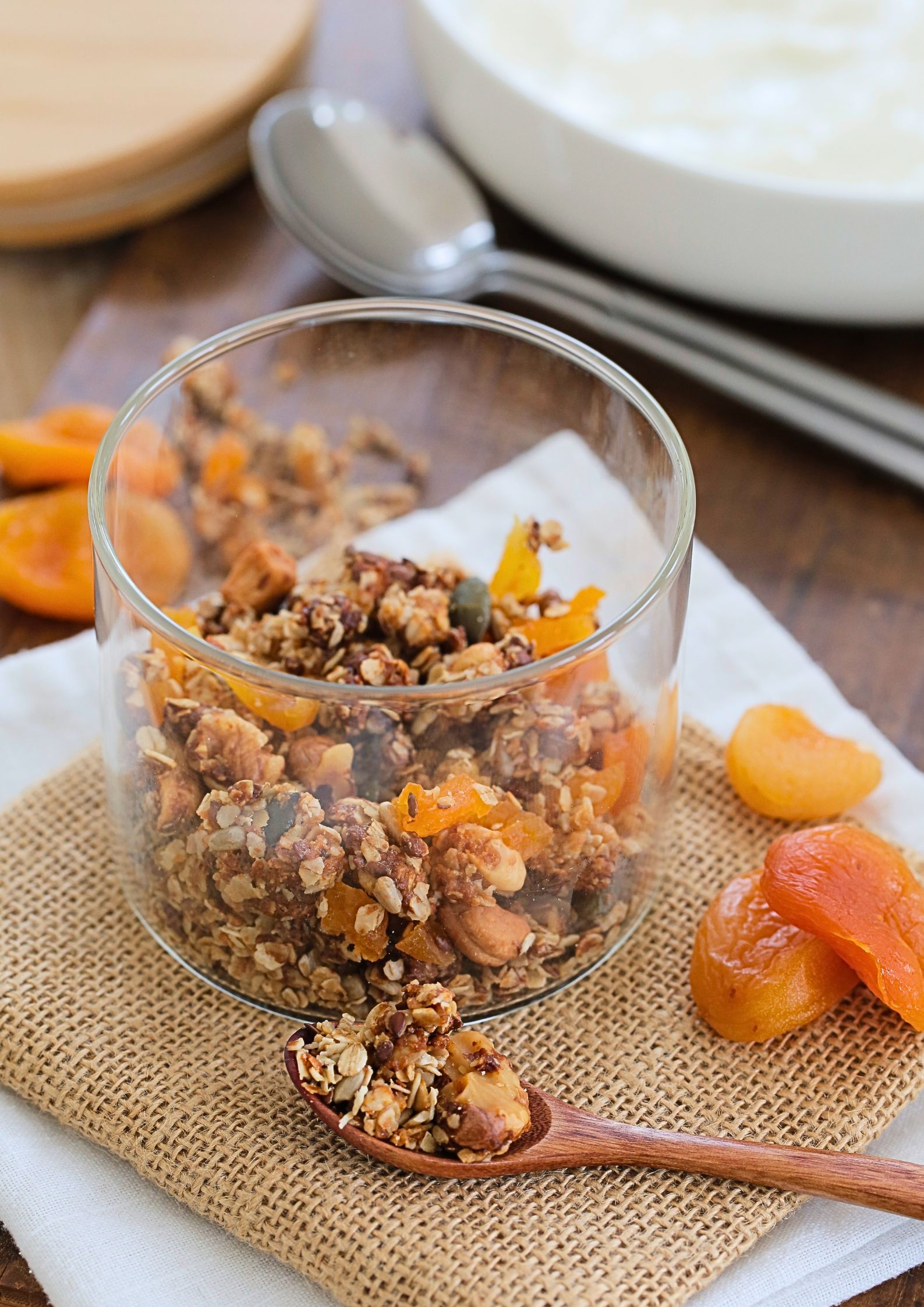 This apricot and tahini granola packed with rich, nutty flavour and naturally sweet dried fruit is totally vegan and gluten free. Perfect for sprinkling over yoghurt or porridge, enjoying with plant milk, or snacking straight from the jar. The blend of nuts, seeds, and oats makes it a nutritious choice as it's also refined sugar free, making it a guilt-free treat you can enjoy any time of day.